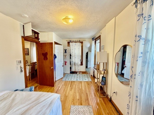 11 Foster Street, Unit 5 Boston, MA 02109 - Photo 13 of 19 a bedroom with a bed and a large mirror