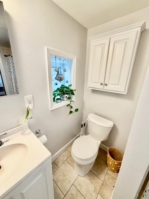 11 Foster Street, Unit 5 Boston, MA 02109 - Photo 16 of 19 a white toilet sitting next to a bathroom sink