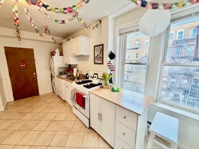11 Foster Street, Unit 5 Boston, MA 02109 - Photo 5 of 19 a kitchen with granite countertop a sink and a stove
