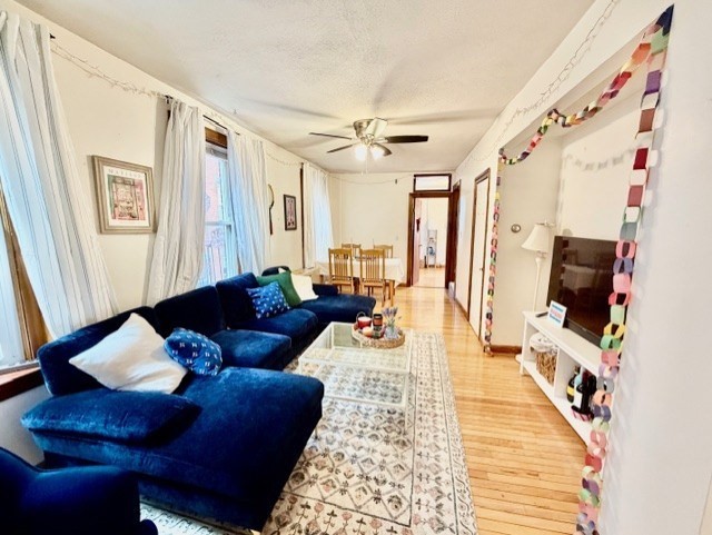11 Foster Street, Unit 5 Boston, MA 02109 - Photo 7 of 19 a living room with furniture and a flat screen tv