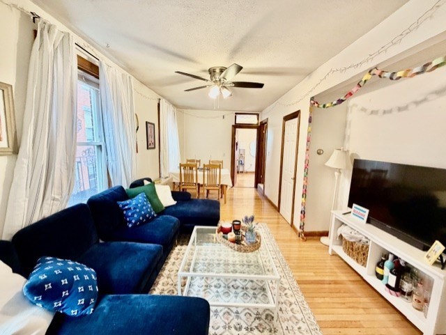 11 Foster Street, Unit 5 Boston, MA 02109 - Photo 8 of 19 a living room with furniture and a flat screen tv