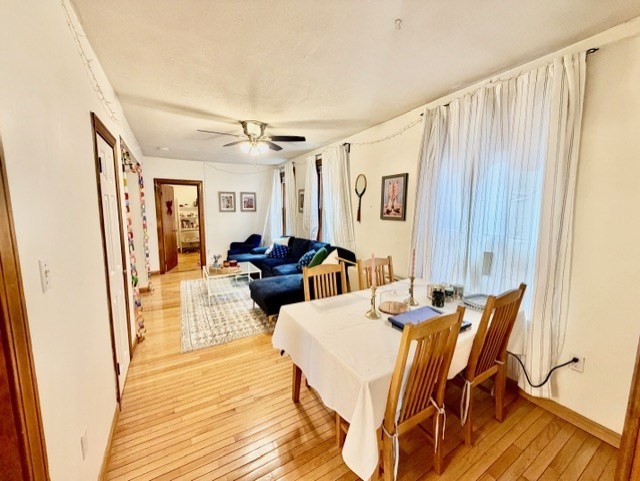 11 Foster Street, Unit 5 Boston, MA 02109 - Photo 9 of 19 a view of a dining room with furniture window and wooden floor