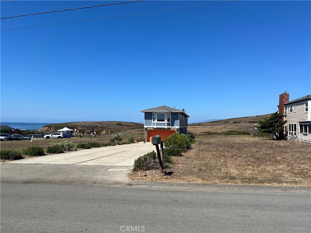 0 Wedgewood Street Cambria, CA 93428 - Photo 12 of 24 a view of a street with a building in the background