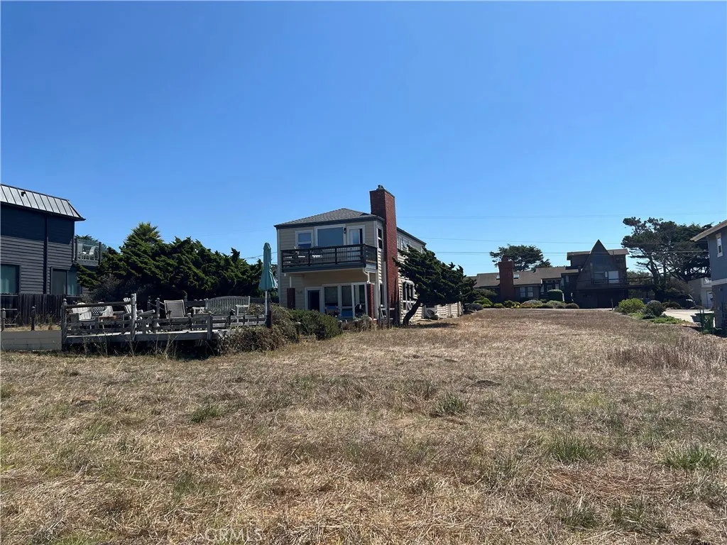 0 Wedgewood Street Cambria, CA 93428 - Photo 16 of 24 a view of a house with a patio and a yard