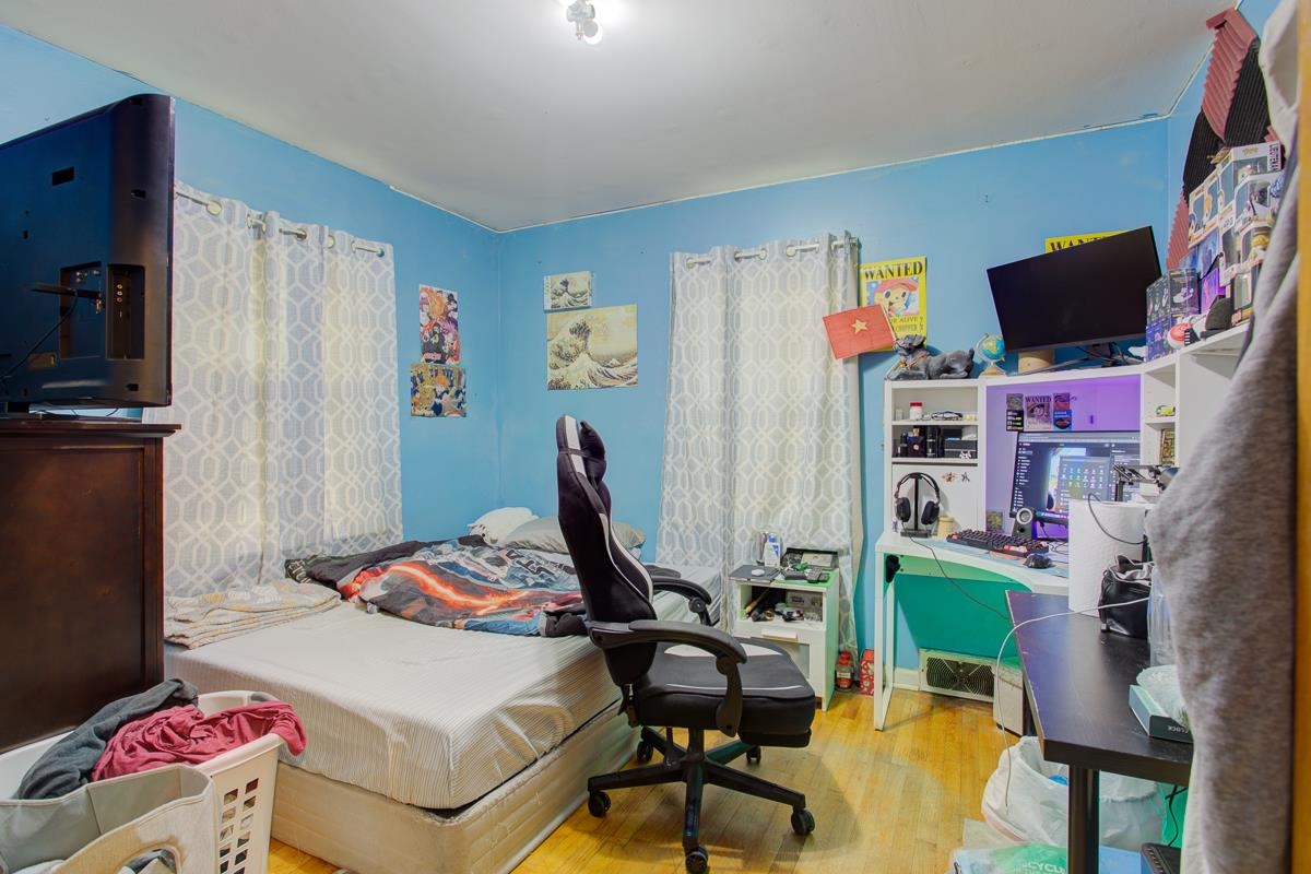 1019 Tatum Road Memphis, TN 38122 - Photo 15 of 21 Bedroom with light wood finished floors and an office area