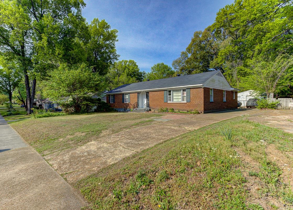 1019 Tatum Road Memphis, TN 38122 - Photo 17 of 21 Single story home featuring concrete driveway, brick siding, and a front yard