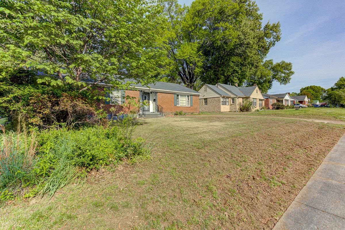 1019 Tatum Road Memphis, TN 38122 - Photo 18 of 21 Ranch-style house with a front yard and brick siding