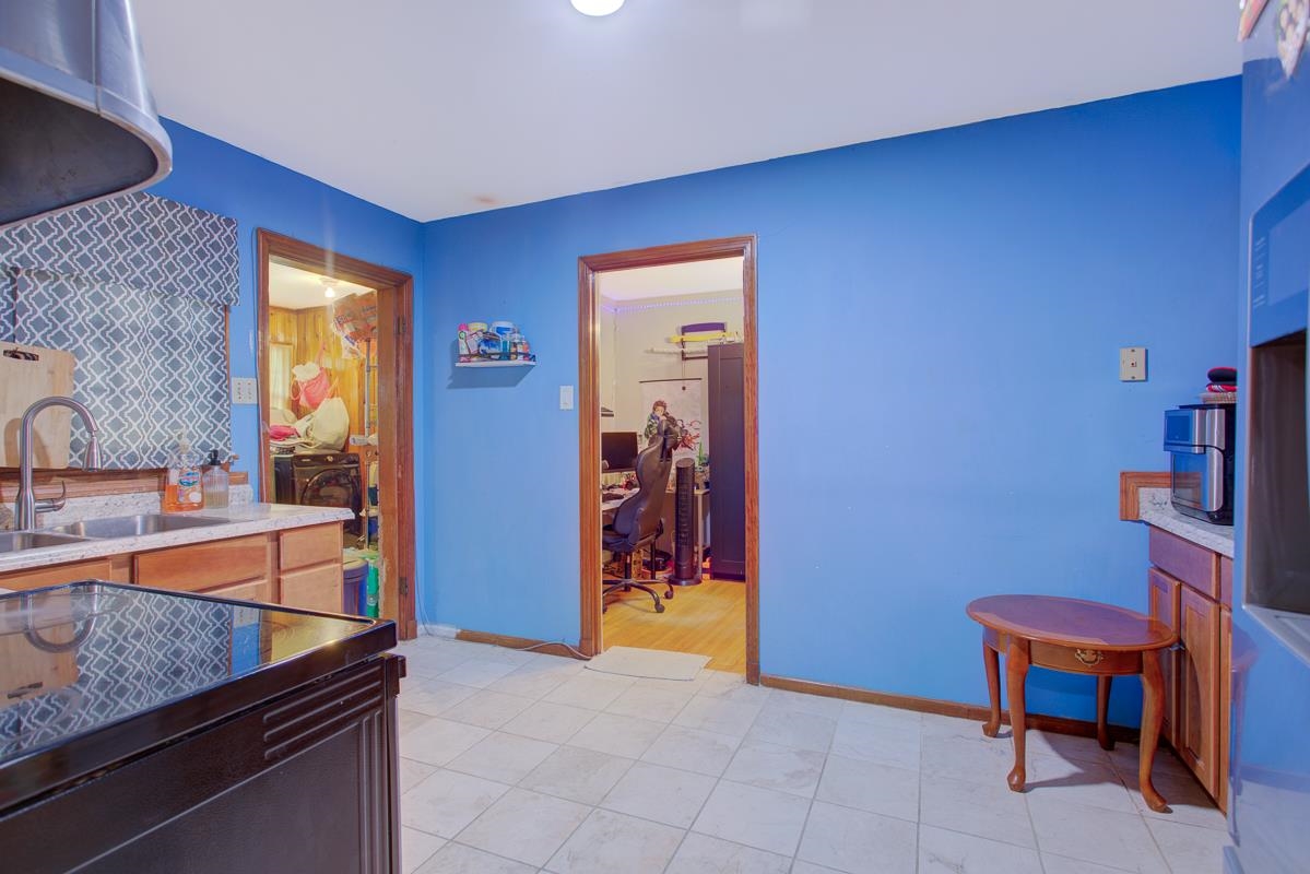 1019 Tatum Road Memphis, TN 38122 - Photo 5 of 21 Kitchen with extractor fan and refrigerator