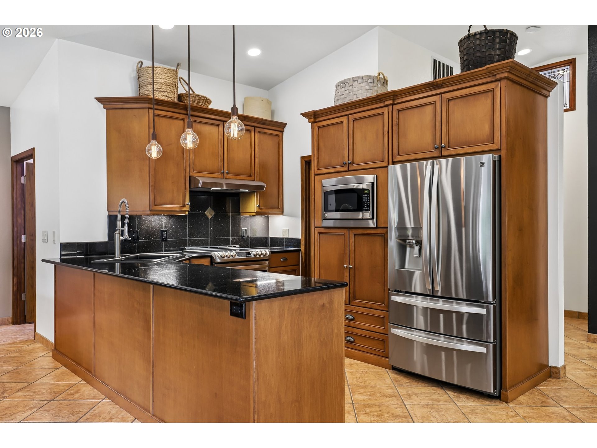 873 Mountain View Road Kalama, WA 98625 - Photo 20 of 45 a kitchen with stainless steel appliances a sink and a refrigerator