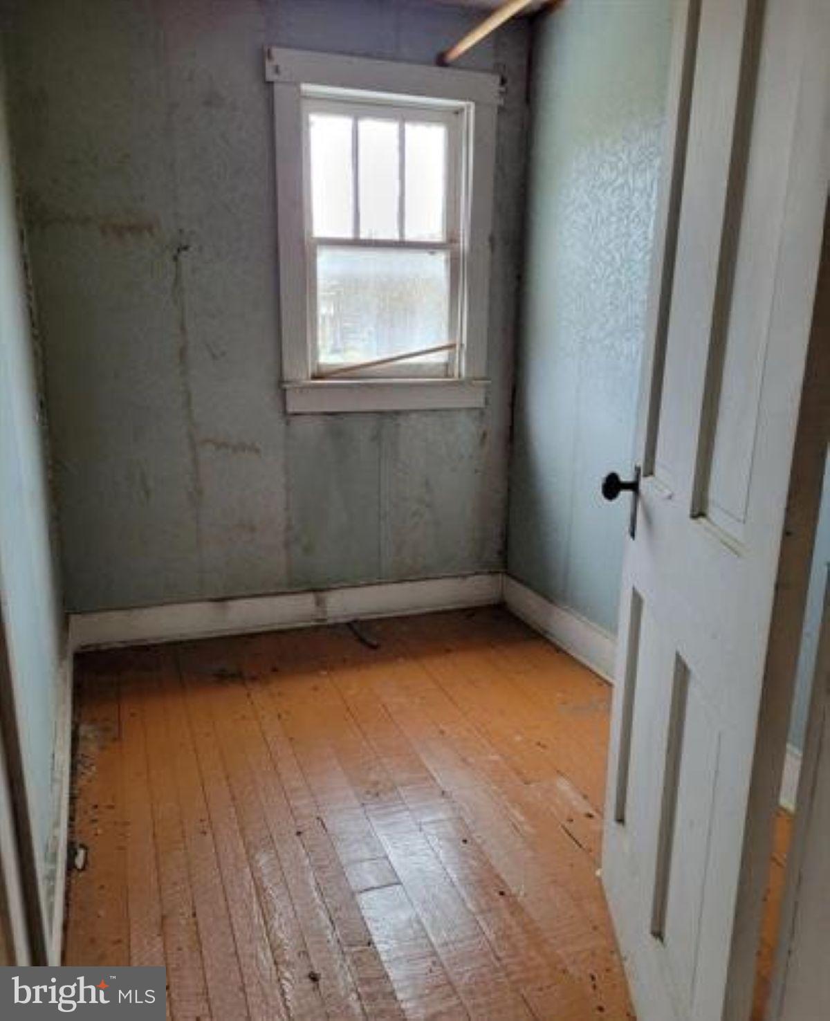 99 Little Cacapon Road Romney, WV 26757 - Photo 12 of 25 an empty room with a window