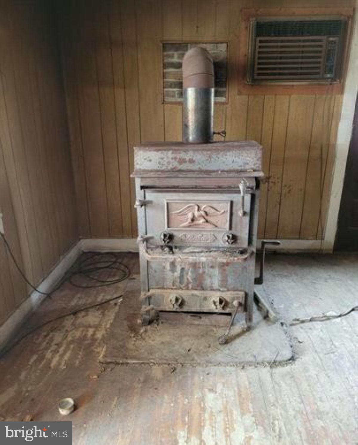 99 Little Cacapon Road Romney, WV 26757 - Photo 14 of 25 a room with a fireplace and cabinets