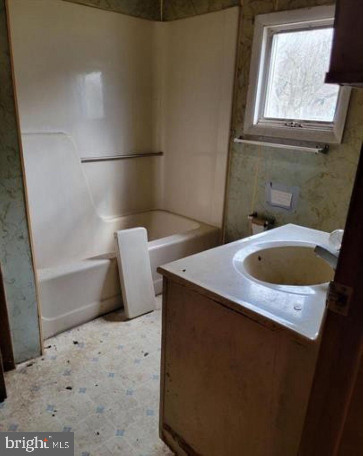 99 Little Cacapon Road Romney, WV 26757 - Photo 18 of 25 a bathroom with a sink and a mirror