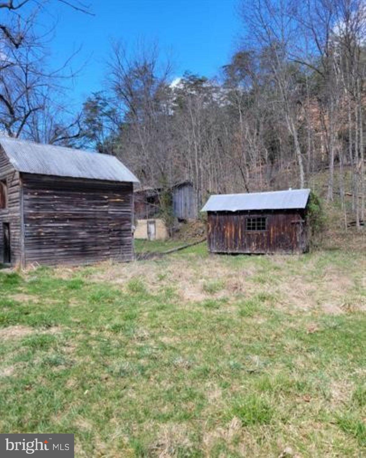 99 Little Cacapon Road Romney, WV 26757 - Photo 19 of 25 a view of a backyard with wooden fence