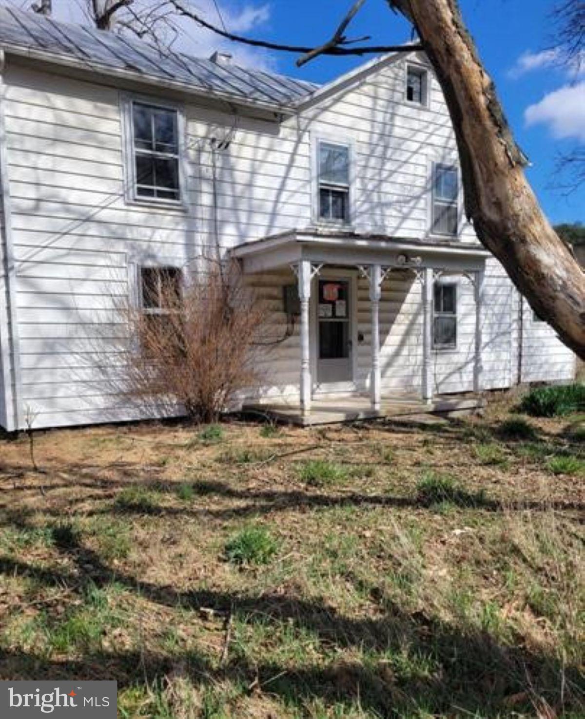 99 Little Cacapon Road Romney, WV 26757 - Photo 2 of 25 a view of a house with a yard