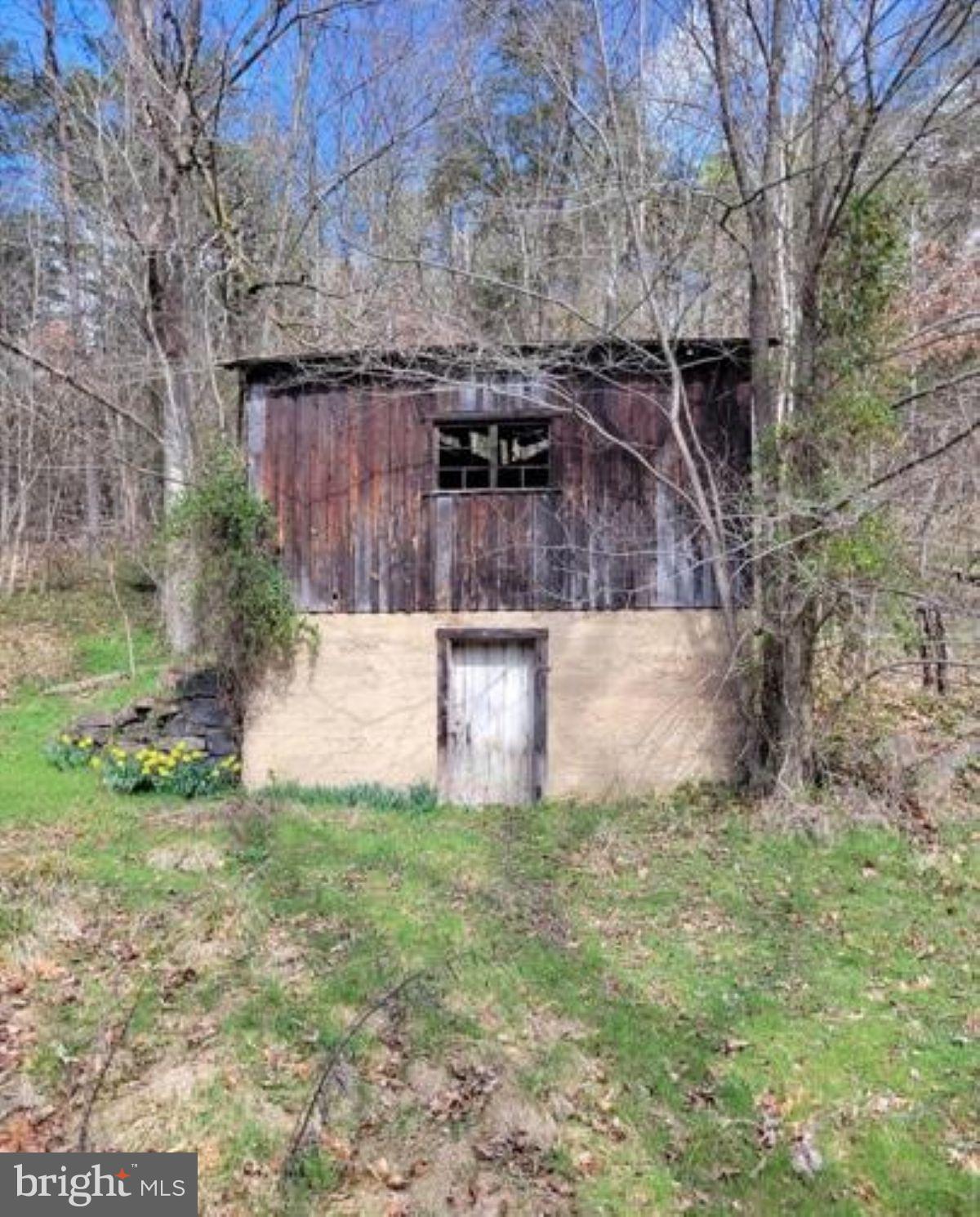 99 Little Cacapon Road Romney, WV 26757 - Photo 25 of 25 a front view of a house with garden