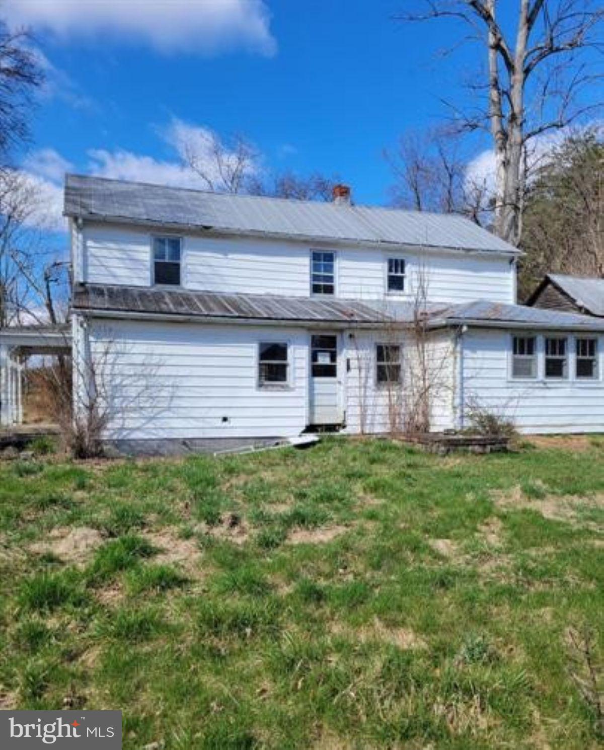 99 Little Cacapon Road Romney, WV 26757 - Photo 3 of 25 a view of a house with a backyard