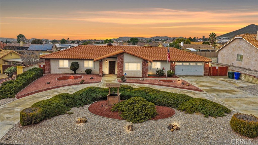 16224 Olalee Road Apple Valley, CA 92307 - Photo 1 of 48 a front view of a house with a yard and lake view