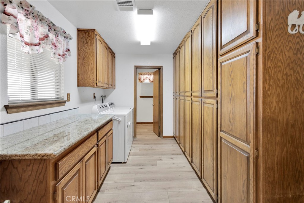 16224 Olalee Road Apple Valley, CA 92307 - Photo 29 of 48 a bathroom with a granite countertop sink and a mirror