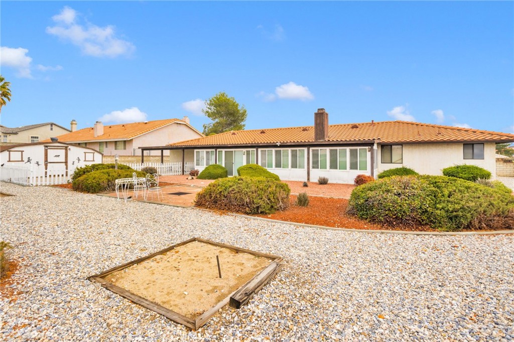 16224 Olalee Road Apple Valley, CA 92307 - Photo 36 of 48 a view of a house with a swimming pool