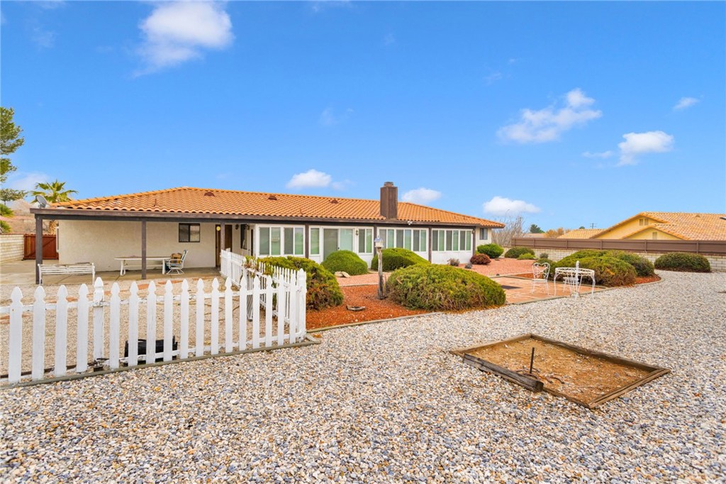 16224 Olalee Road Apple Valley, CA 92307 - Photo 38 of 48 a front view of a house with a yard