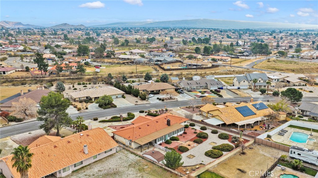 16224 Olalee Road Apple Valley, CA 92307 - Photo 44 of 48 an aerial view of residential building with parking