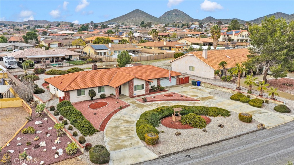 16224 Olalee Road Apple Valley, CA 92307 - Photo 46 of 48 an aerial view of residential houses and outdoor space