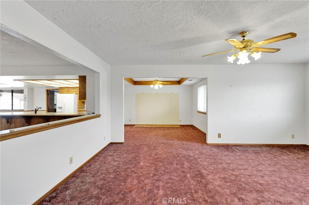 16224 Olalee Road Apple Valley, CA 92307 - Photo 5 of 48 wooden floor in an empty room with a window