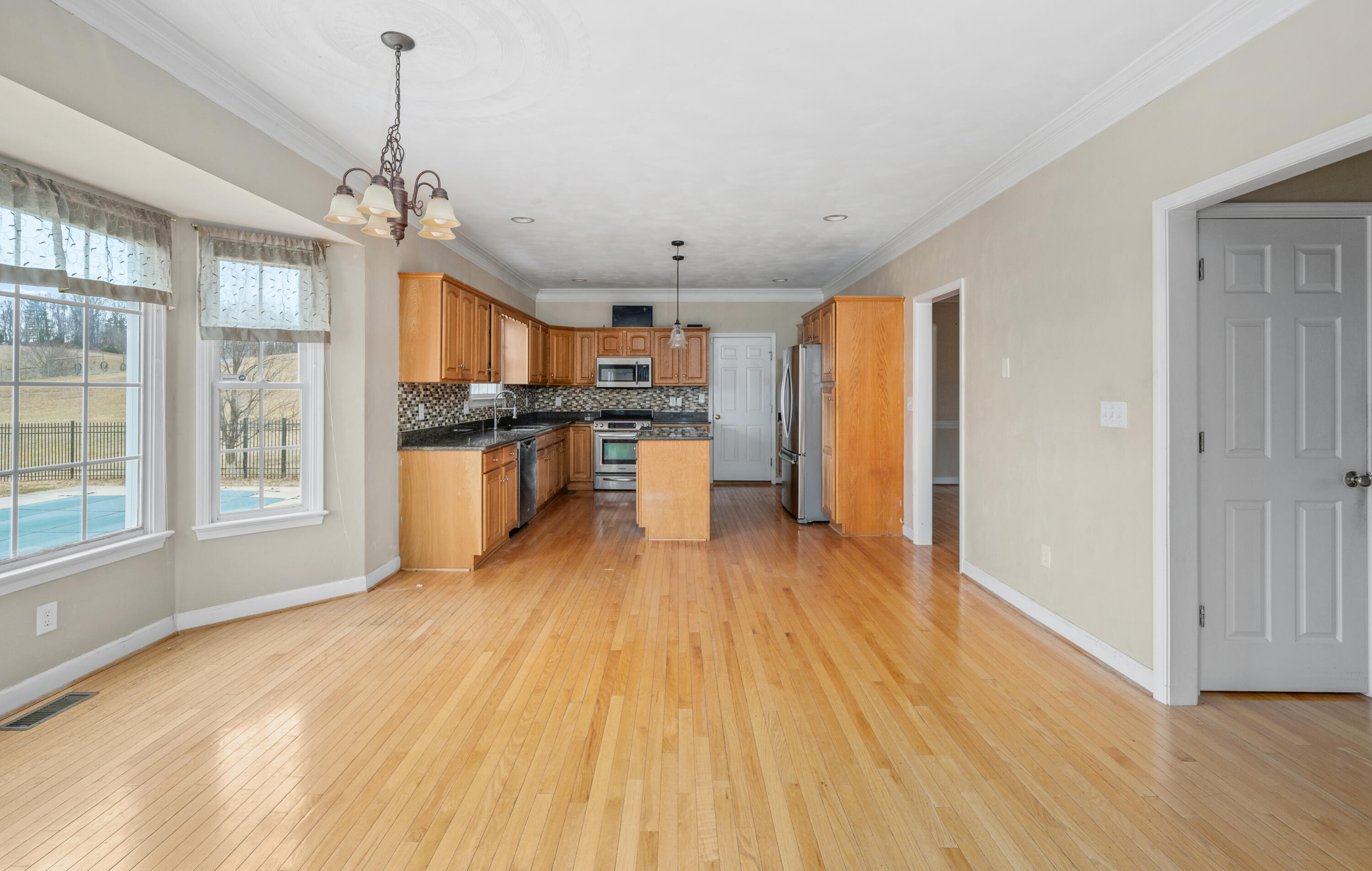 765 Country Club Road Troutville, VA 24175 - Photo 11 of 29 a large kitchen with stainless steel appliances granite countertop a stove and a wooden floors