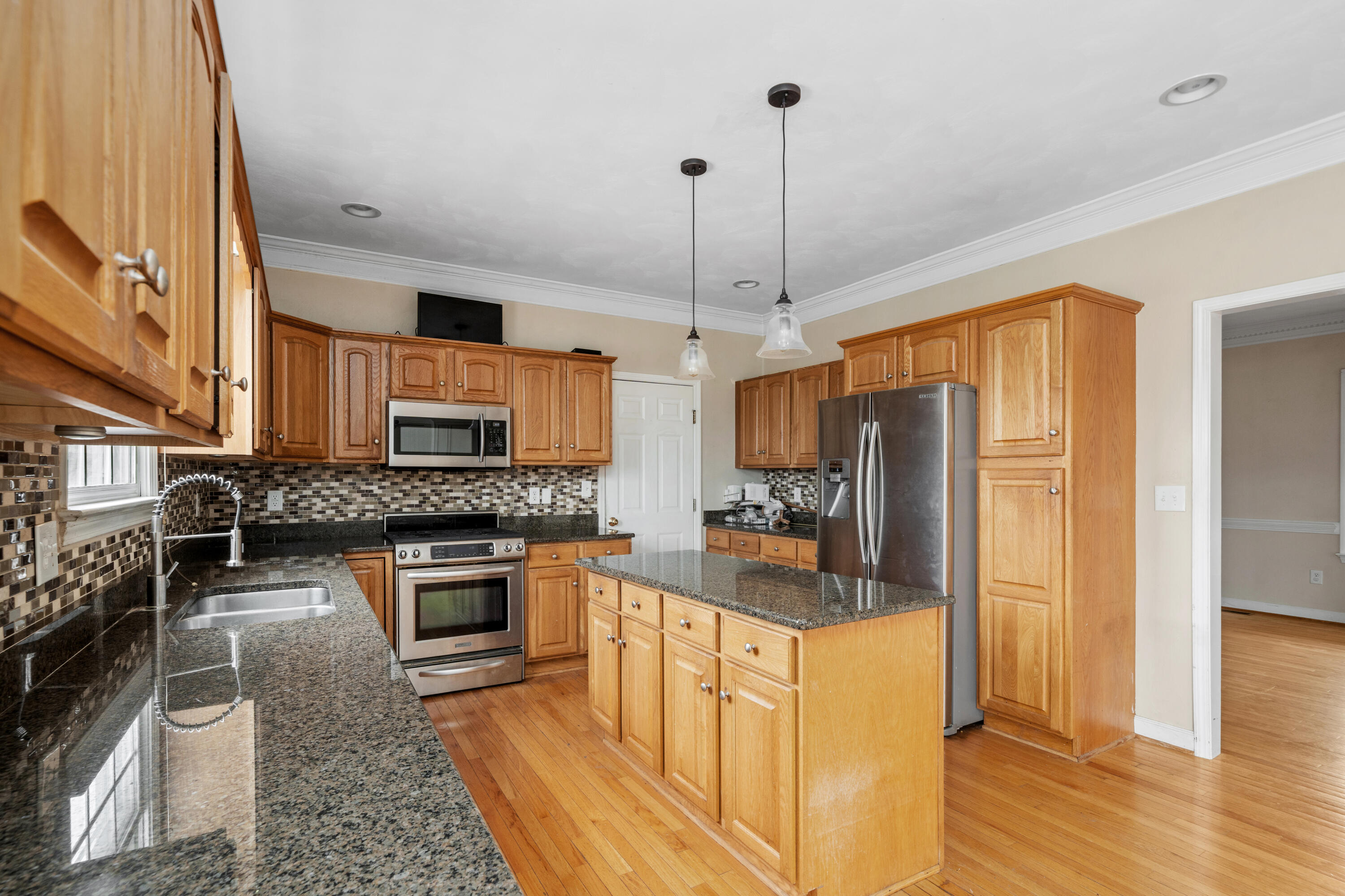 765 Country Club Road Troutville, VA 24175 - Photo 13 of 29 a kitchen with stainless steel appliances granite countertop a stove refrigerator and cabinets