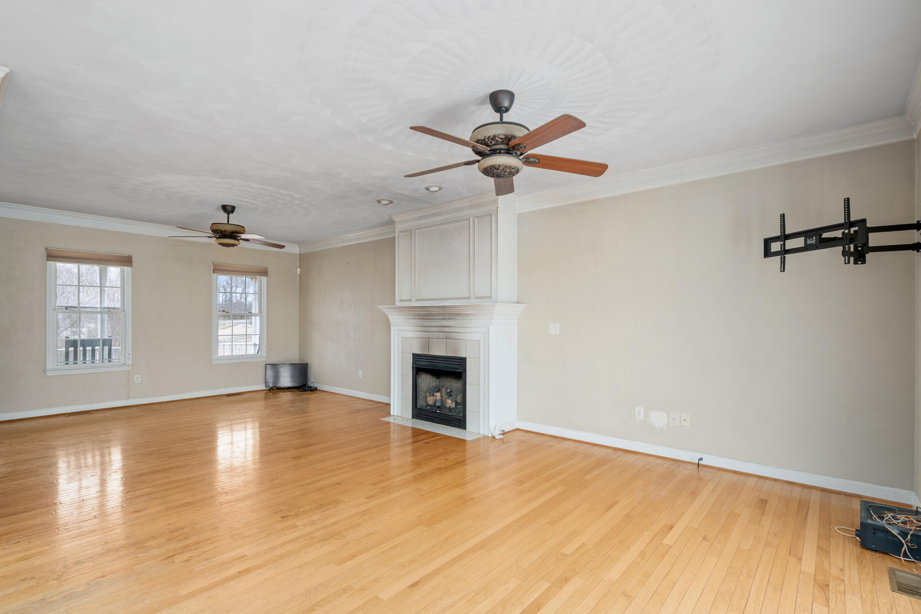 765 Country Club Road Troutville, VA 24175 - Photo 14 of 29 a view of empty room with wooden floor and fireplace