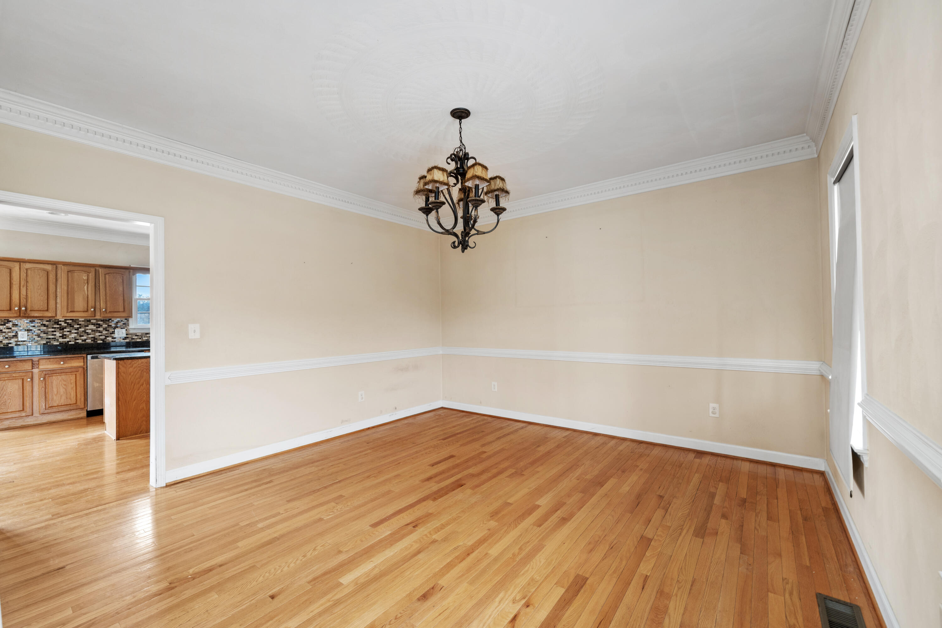 765 Country Club Road Troutville, VA 24175 - Photo 16 of 29 a view of a room with wooden floor and a ceiling fan
