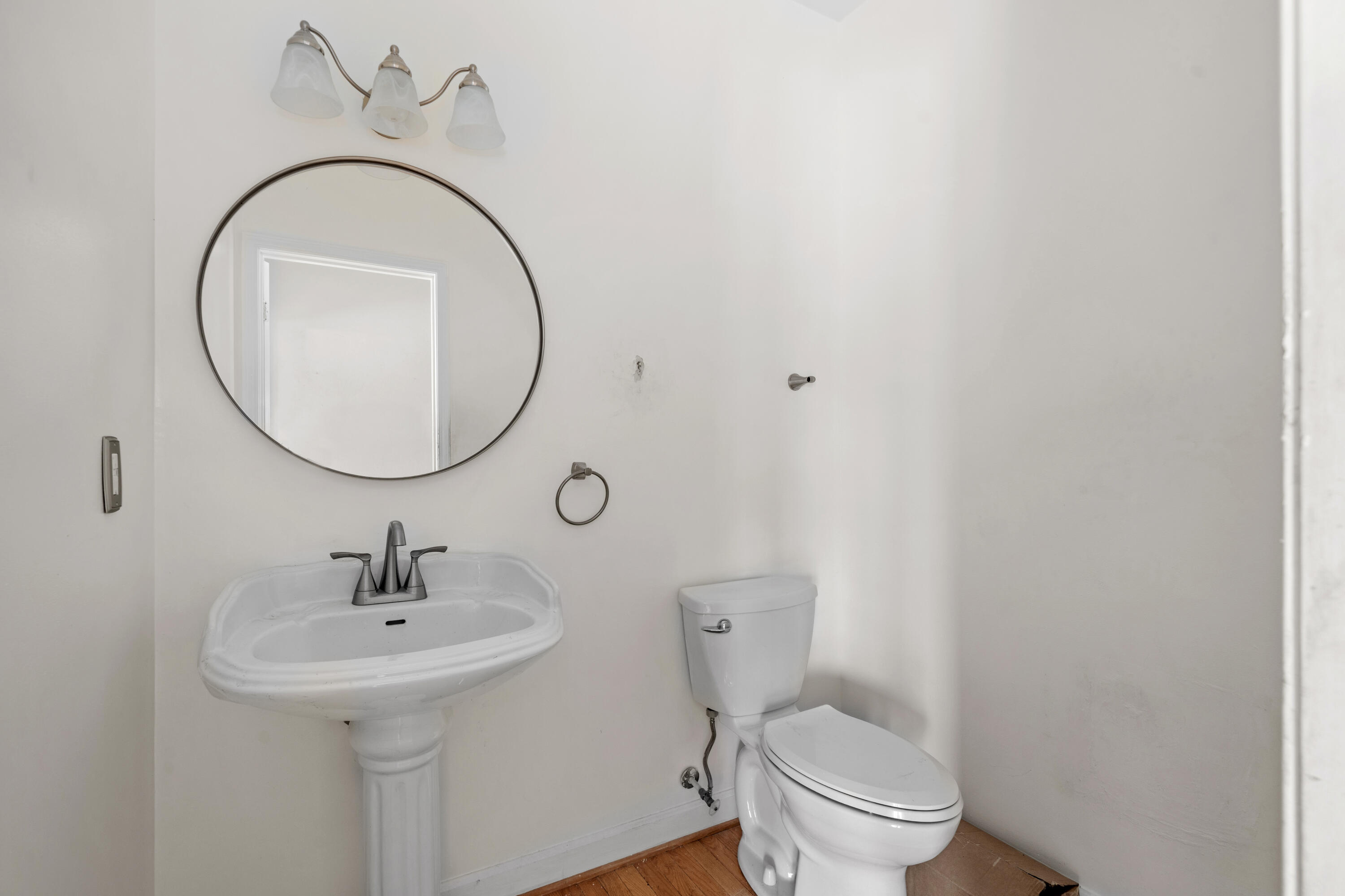 765 Country Club Road Troutville, VA 24175 - Photo 17 of 29 a bathroom with a toilet a sink and a mirror