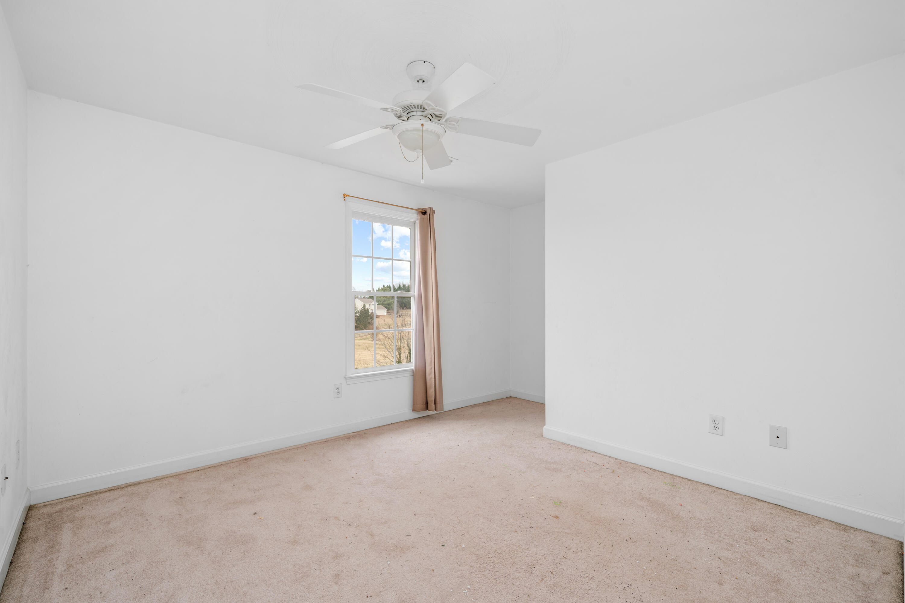 765 Country Club Road Troutville, VA 24175 - Photo 23 of 29 an empty room with windows and fan