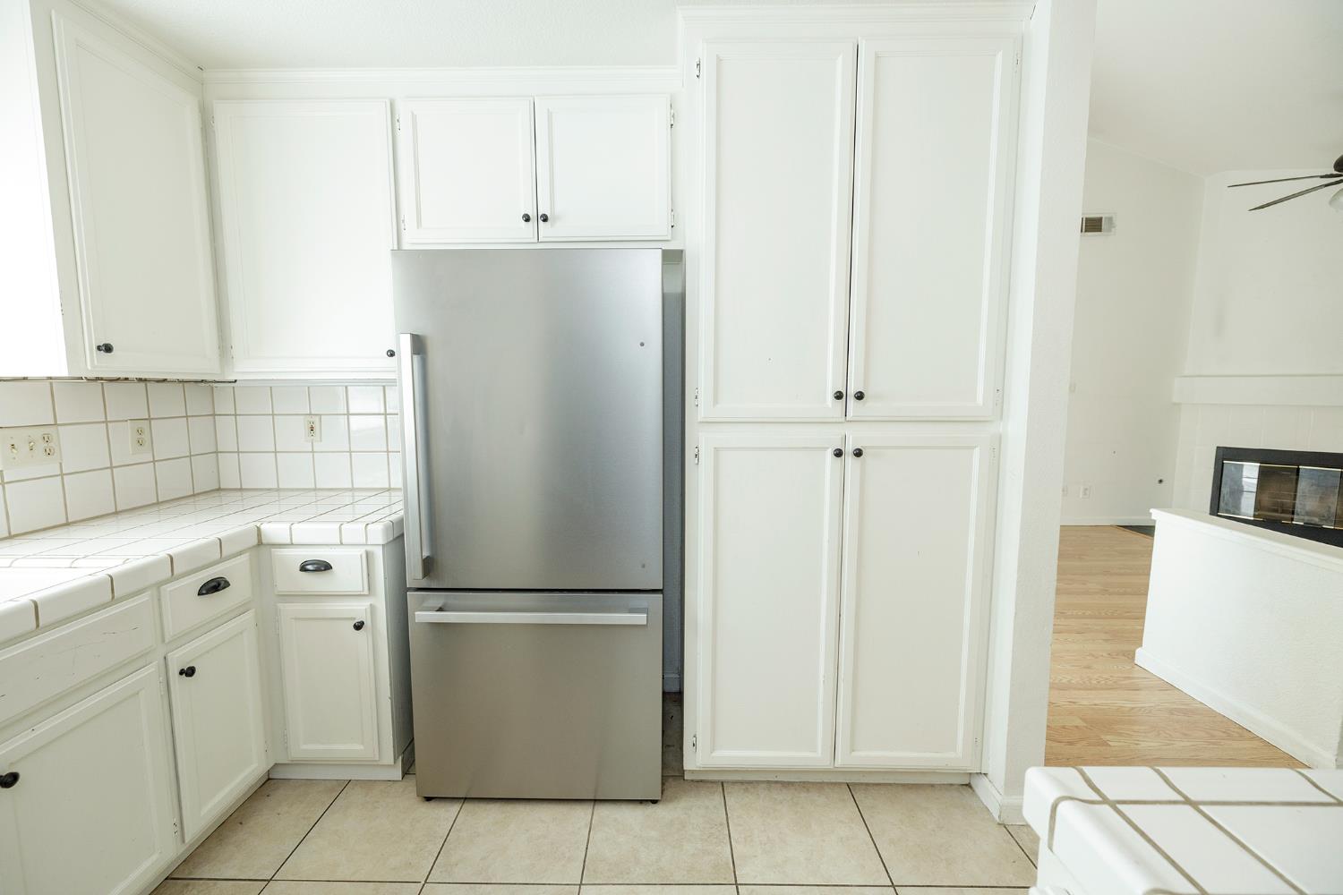 4093 Heartland Way Turlock, CA 95382 - Photo 18 of 43 a kitchen with cabinets and a refrigerator