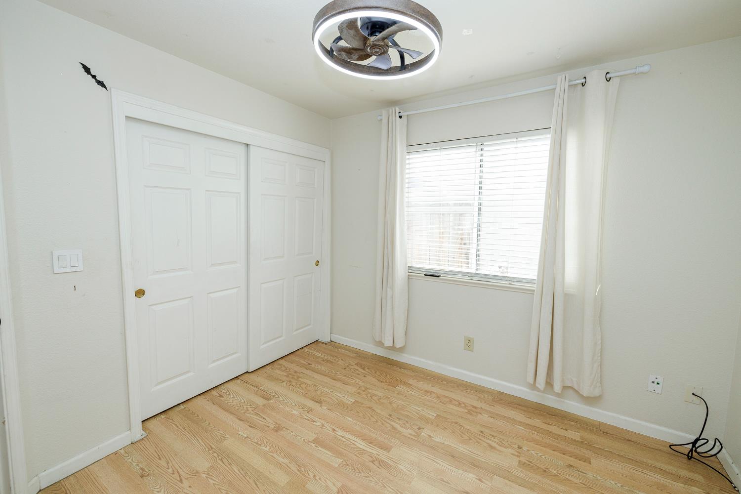 4093 Heartland Way Turlock, CA 95382 - Photo 26 of 43 a view of a livingroom with a chandelier fan and a window