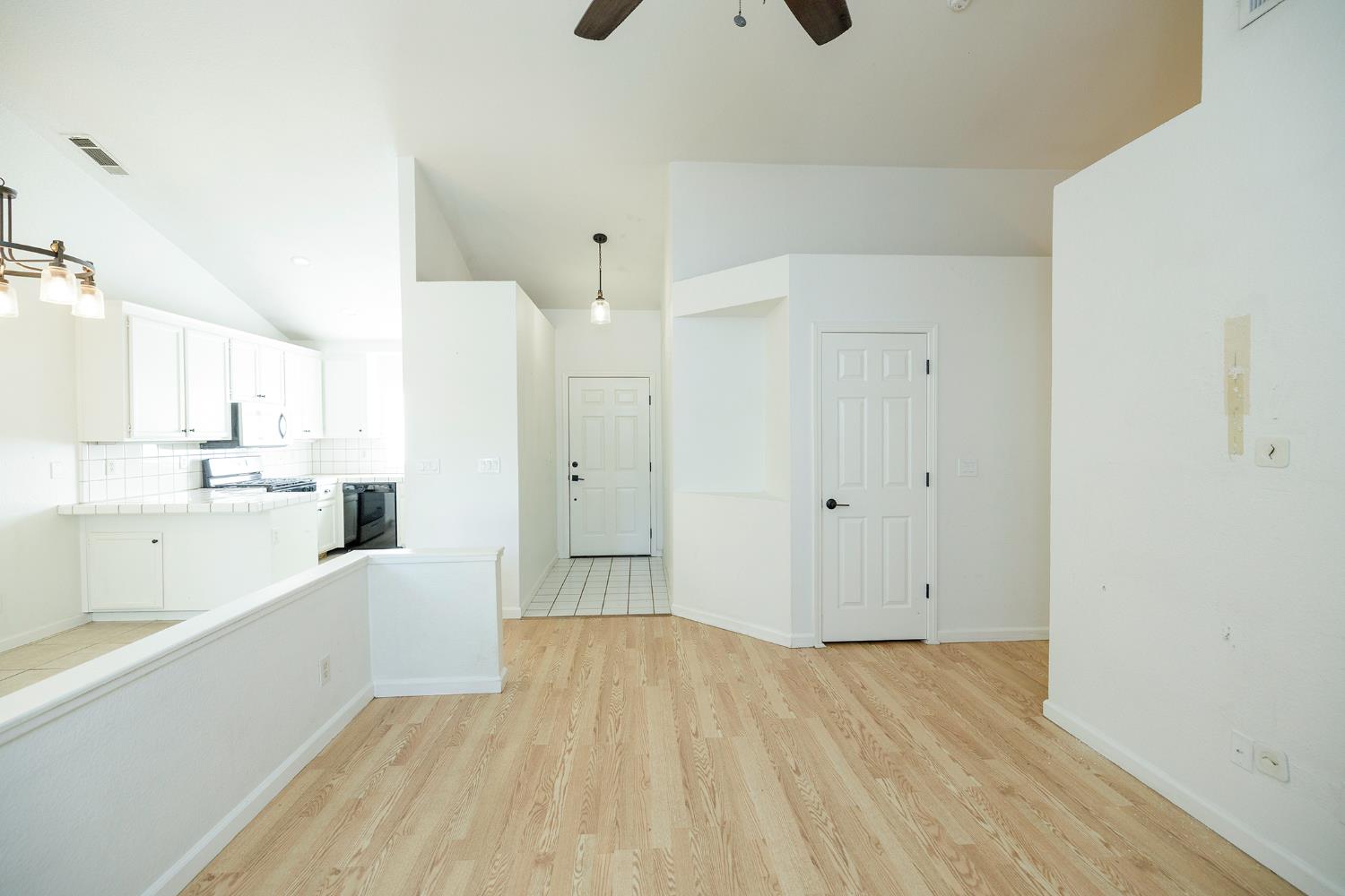 4093 Heartland Way Turlock, CA 95382 - Photo 4 of 43 a view of a kitchen cabinets and wooden floor