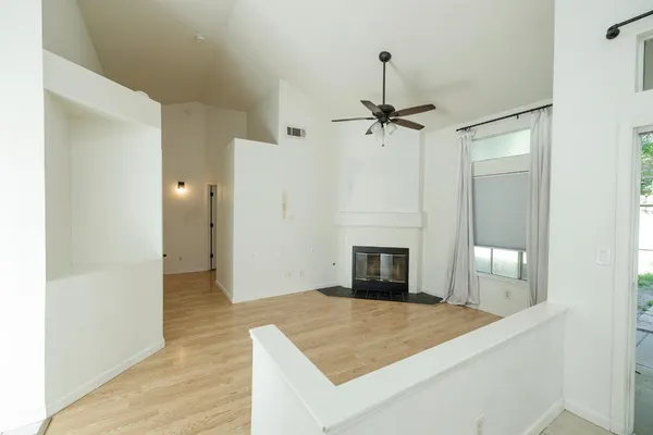 a bedroom with a bed and a fireplace