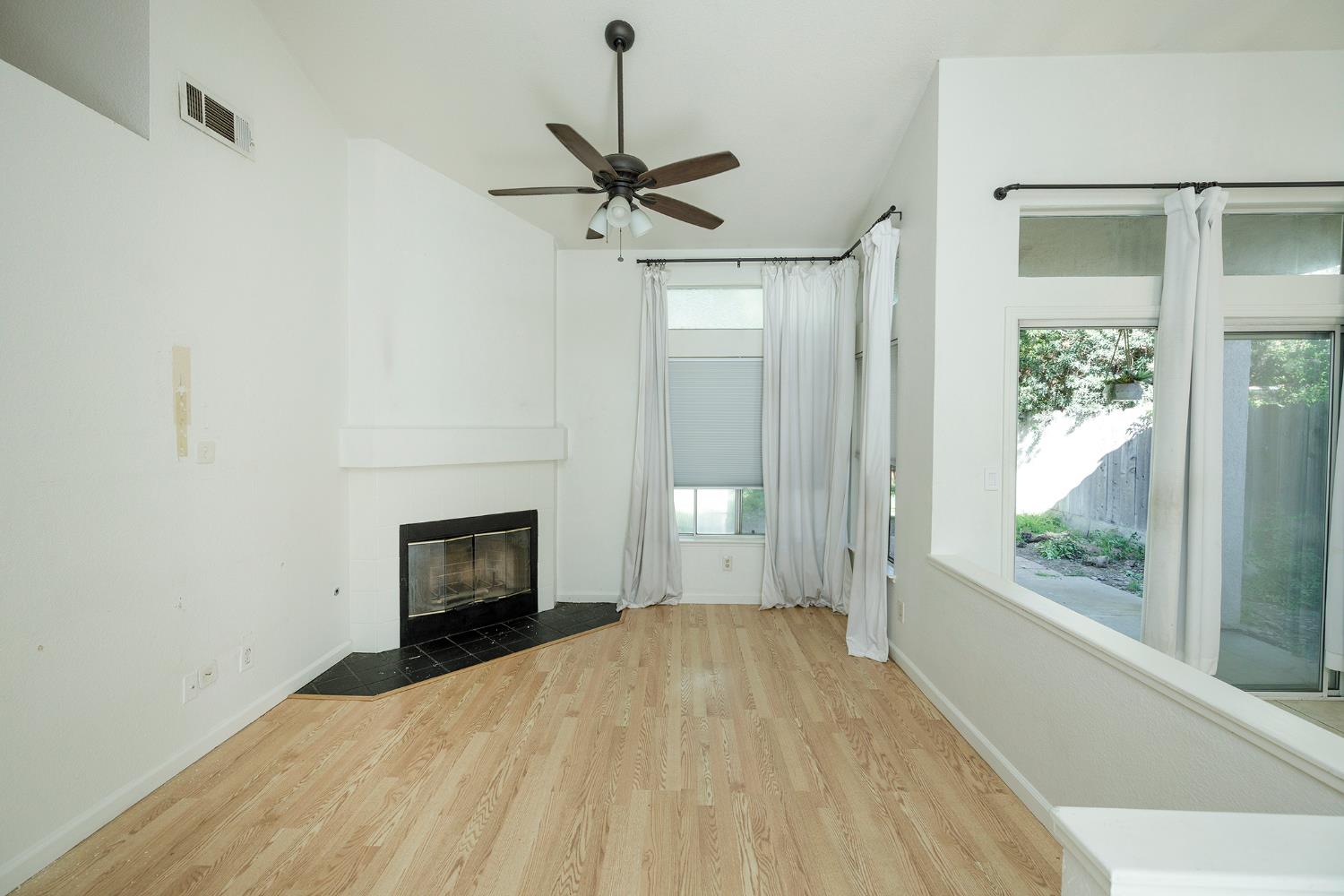 4093 Heartland Way Turlock, CA 95382 - Photo 8 of 43 a bedroom with a bed and a fireplace