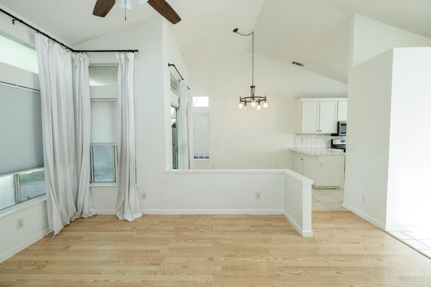 4093 Heartland Way Turlock, CA 95382 - Photo 9 of 43 a view of empty room with wooden floor