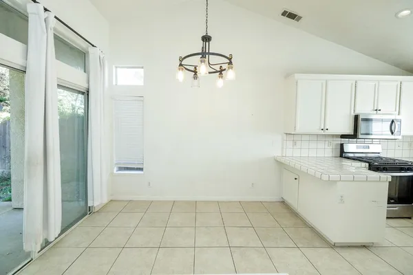 a view of an entryway with a chandelier