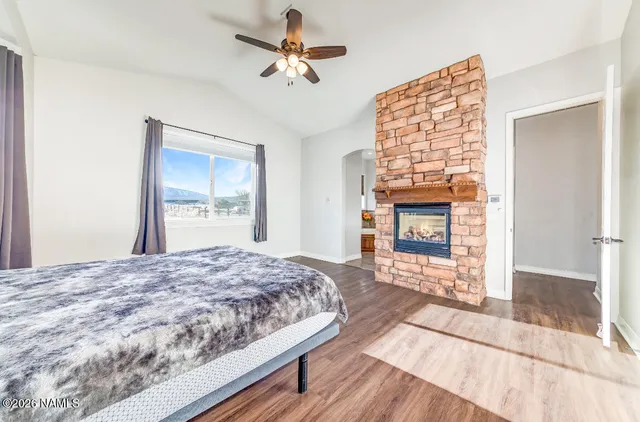 a room with wooden floor and furniture