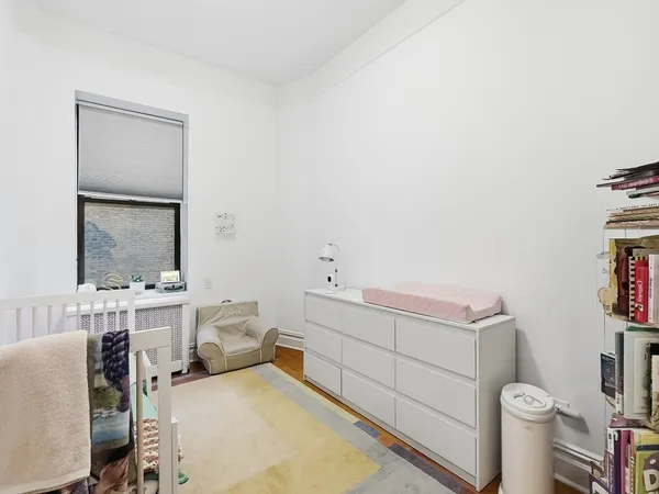 a bathroom with a sink toilet vanity and mirror