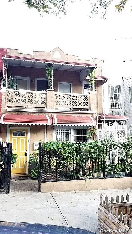 a view of building with potted plants