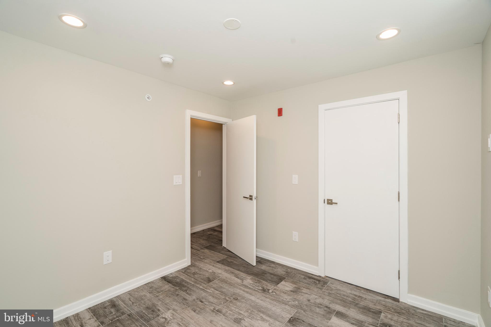 1701 Bainbridge Street, Unit 1 Philadelphia, PA 19146 - Photo 16 of 20 an empty room with wooden floor