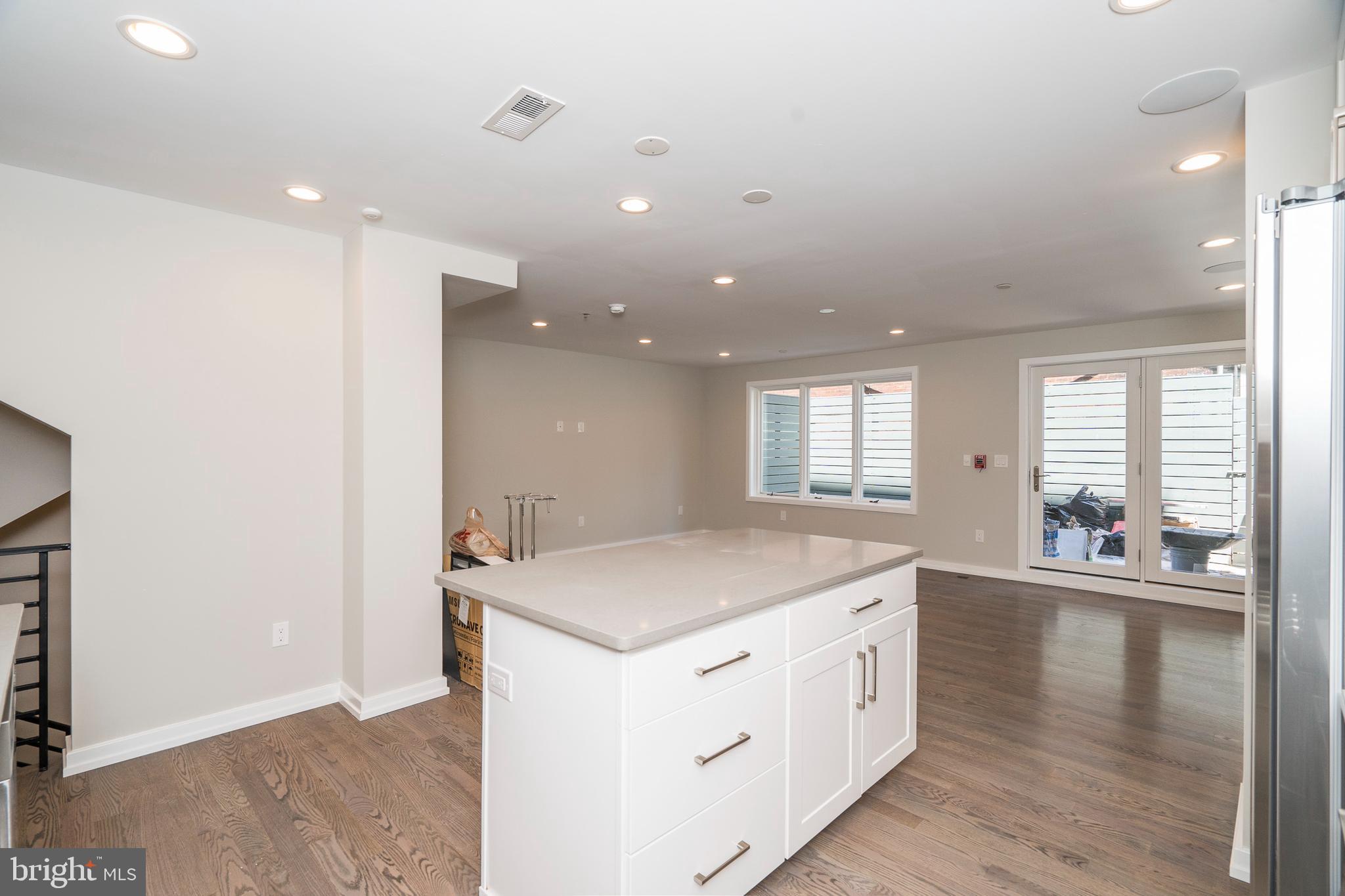 1701 Bainbridge Street, Unit 1 Philadelphia, PA 19146 - Photo 5 of 20 a room with a sink and chandelier