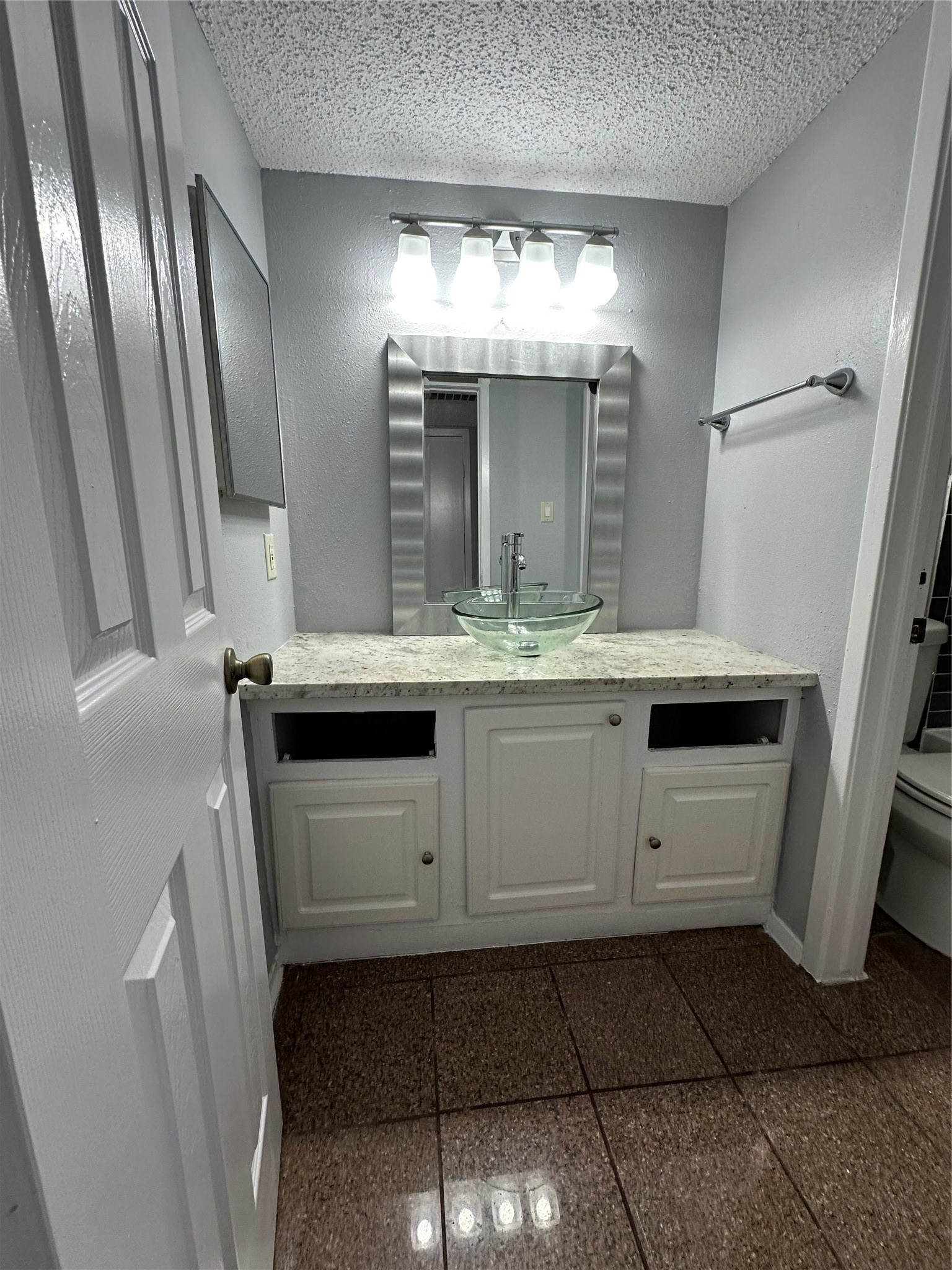 6701 Sands Point Drive, Unit 66 Houston, TX 77074 - Photo 12 of 19 a bathroom with a sink and a mirror