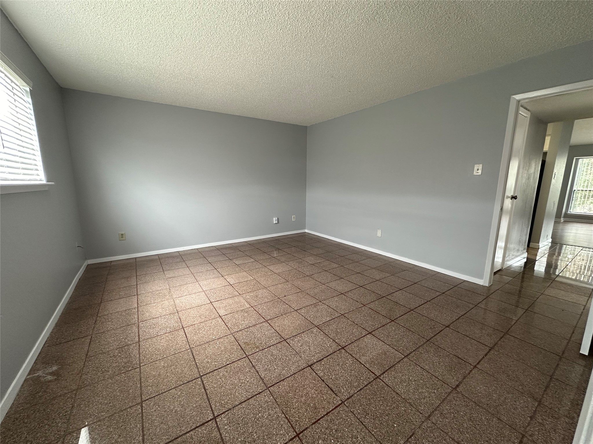 6701 Sands Point Drive, Unit 66 Houston, TX 77074 - Photo 18 of 19 an empty room with windows