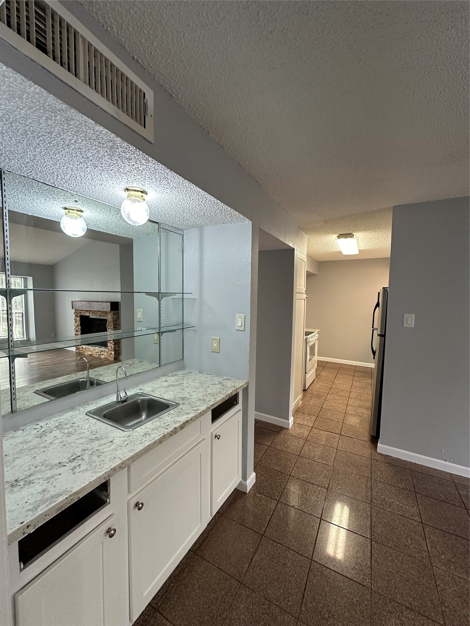 6701 Sands Point Drive, Unit 66 Houston, TX 77074 - Photo 7 of 19 a bathroom with a granite countertop sink and a mirror