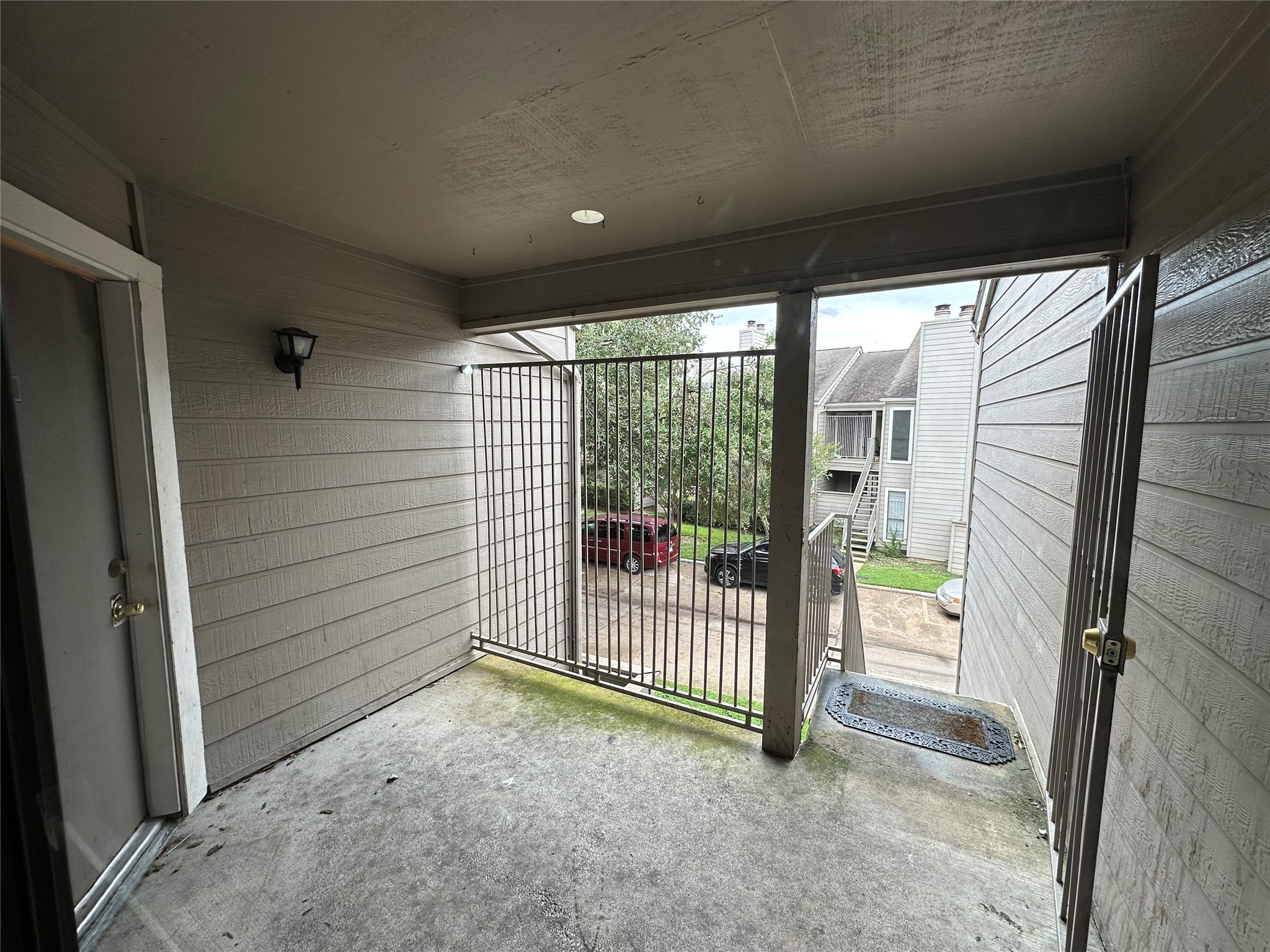6701 Sands Point Drive, Unit 66 Houston, TX 77074 - Photo 8 of 19 a view of porch with a small yard