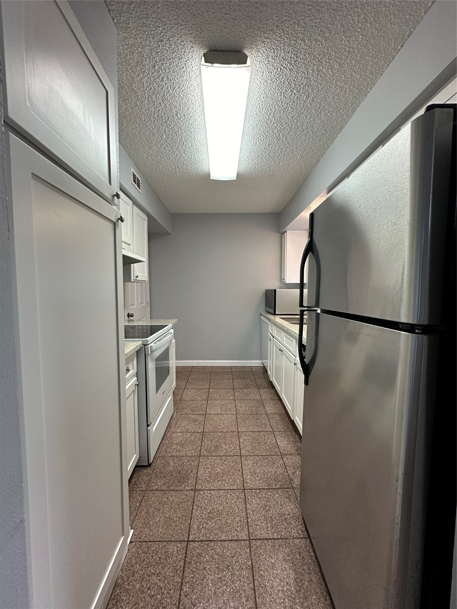 6701 Sands Point Drive, Unit 66 Houston, TX 77074 - Photo 9 of 19 a walk in closet with wooden floor